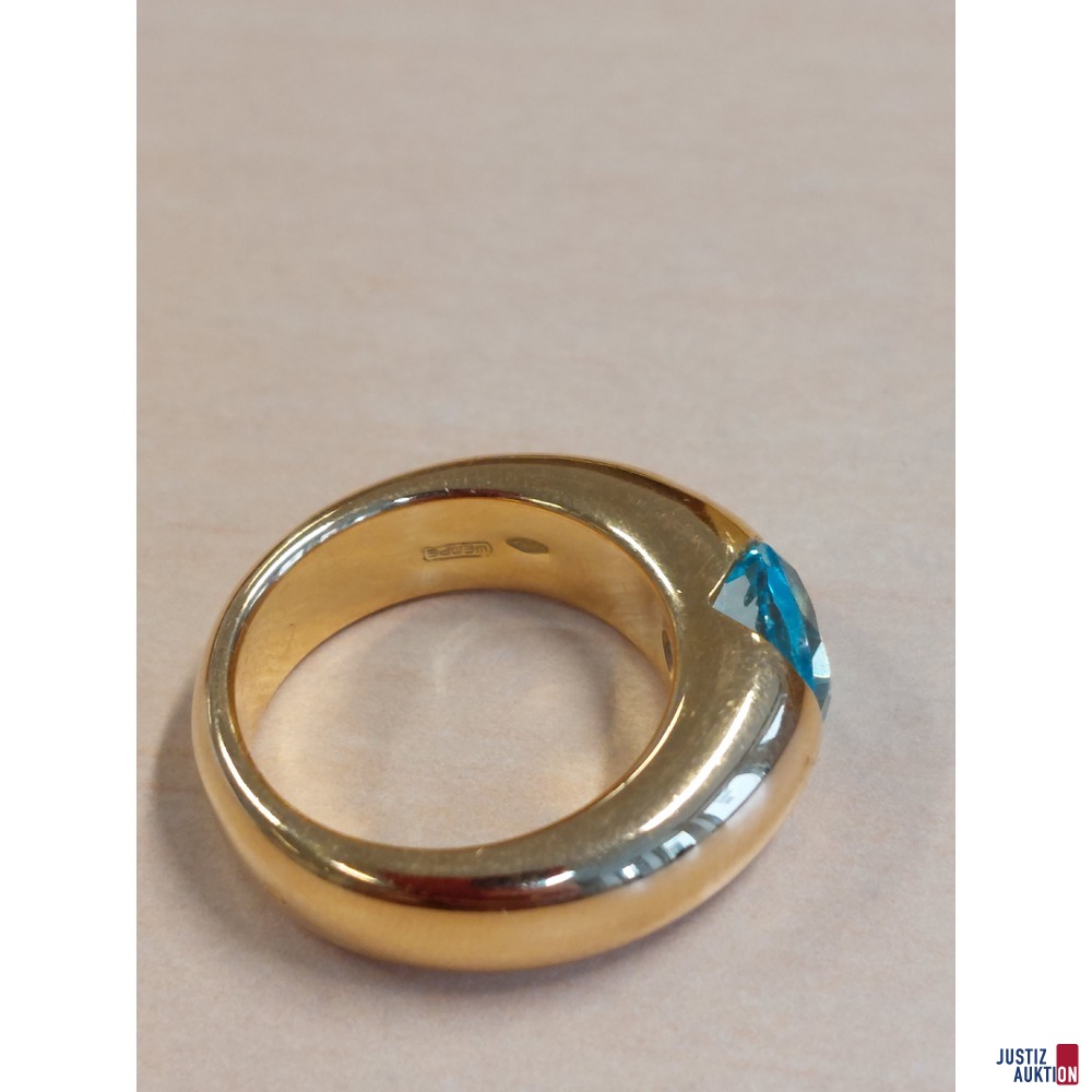 Damenring mit hellblauem Topas 750&permil; punziert