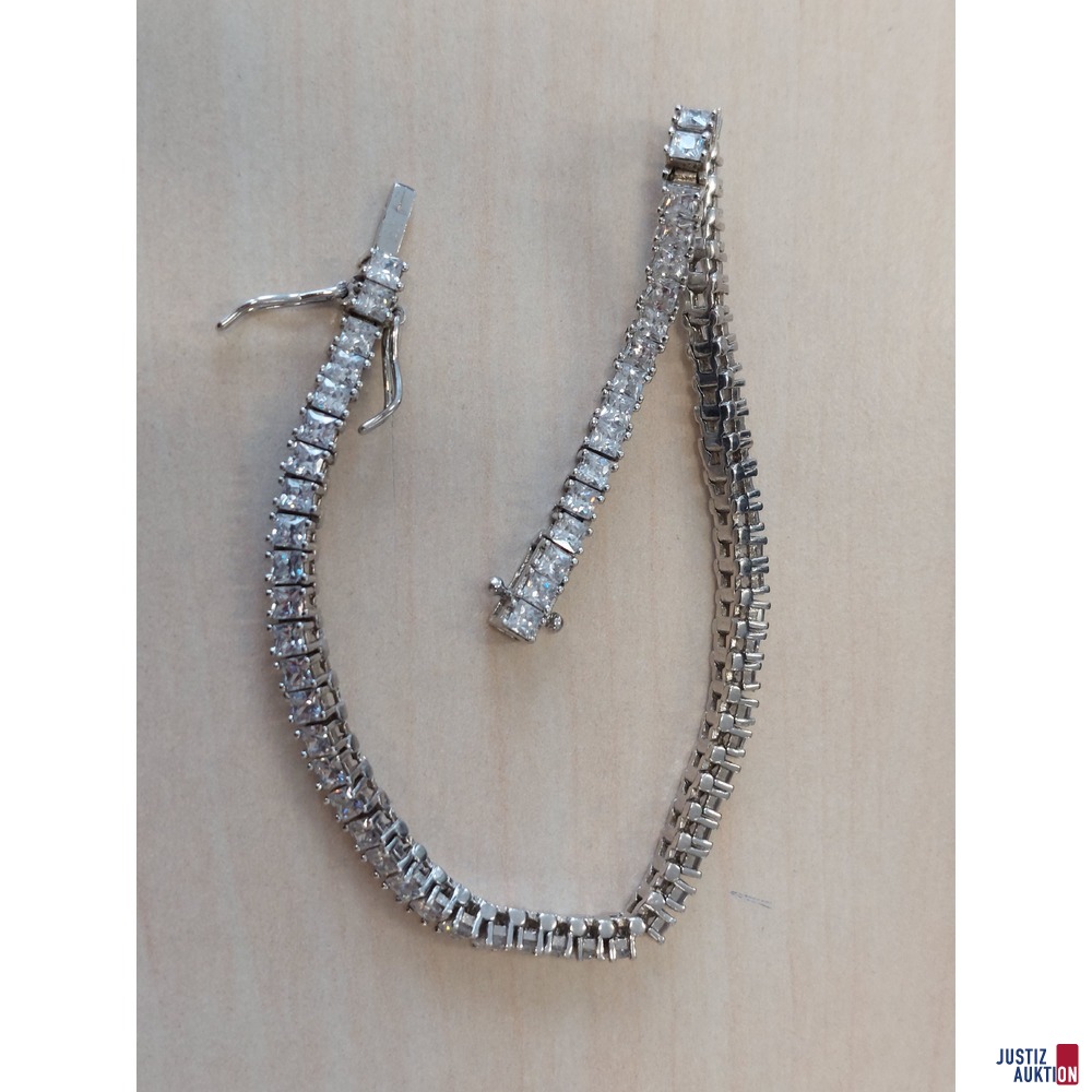 Wei&szlig;goldfarbenes Tennisarmband mit wei&szlig;en Schmuckstein