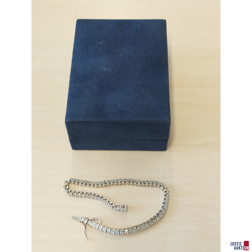Wei&szlig;goldfarbenes Tennisarmband mit wei&szlig;en Schmuckstein