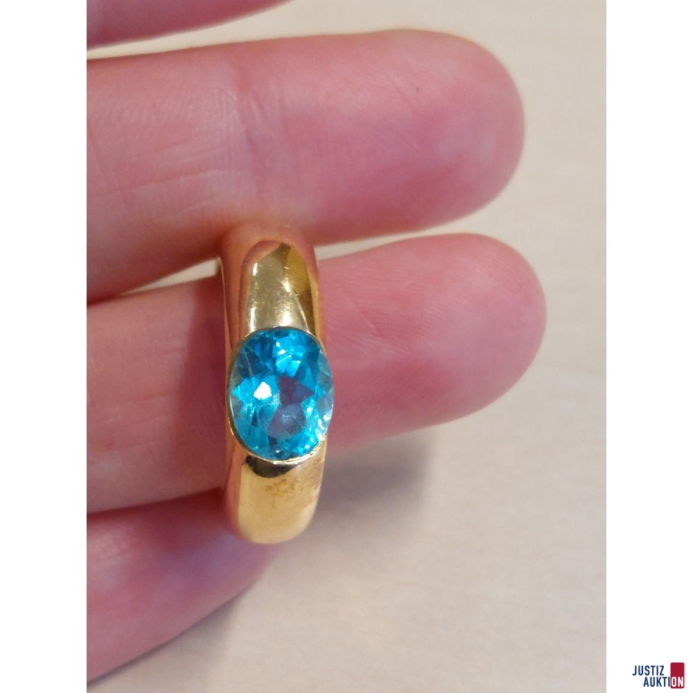 Damenring mit hellblauem Topas 750&permil; punziert