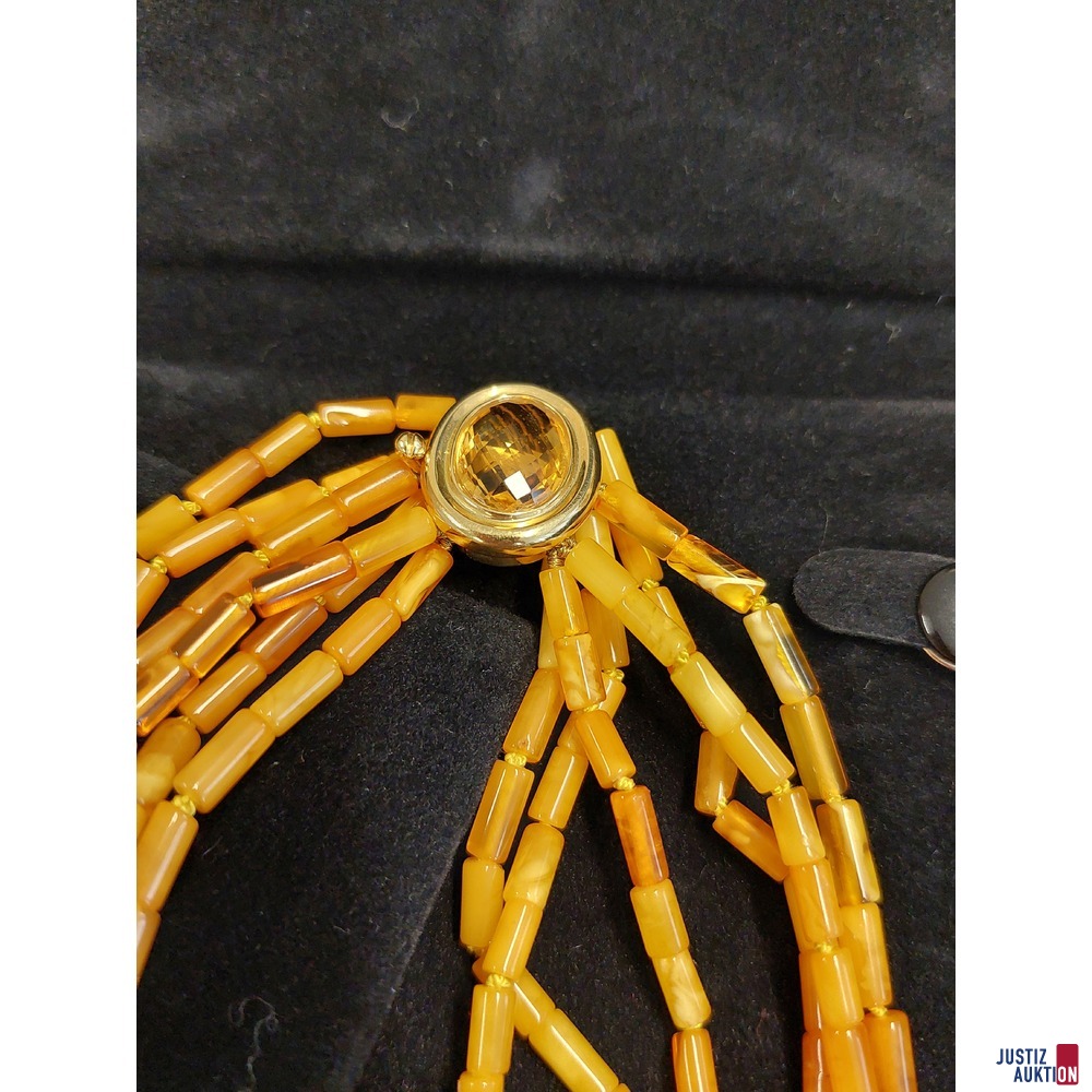 Mehrreihige Bernsteinkette mit 18 Karat