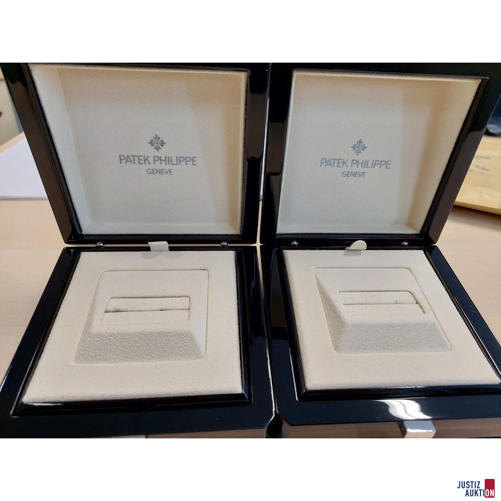 2 leere Uhrenschatullen mit der Aufschrift Patek Philipp Geneve